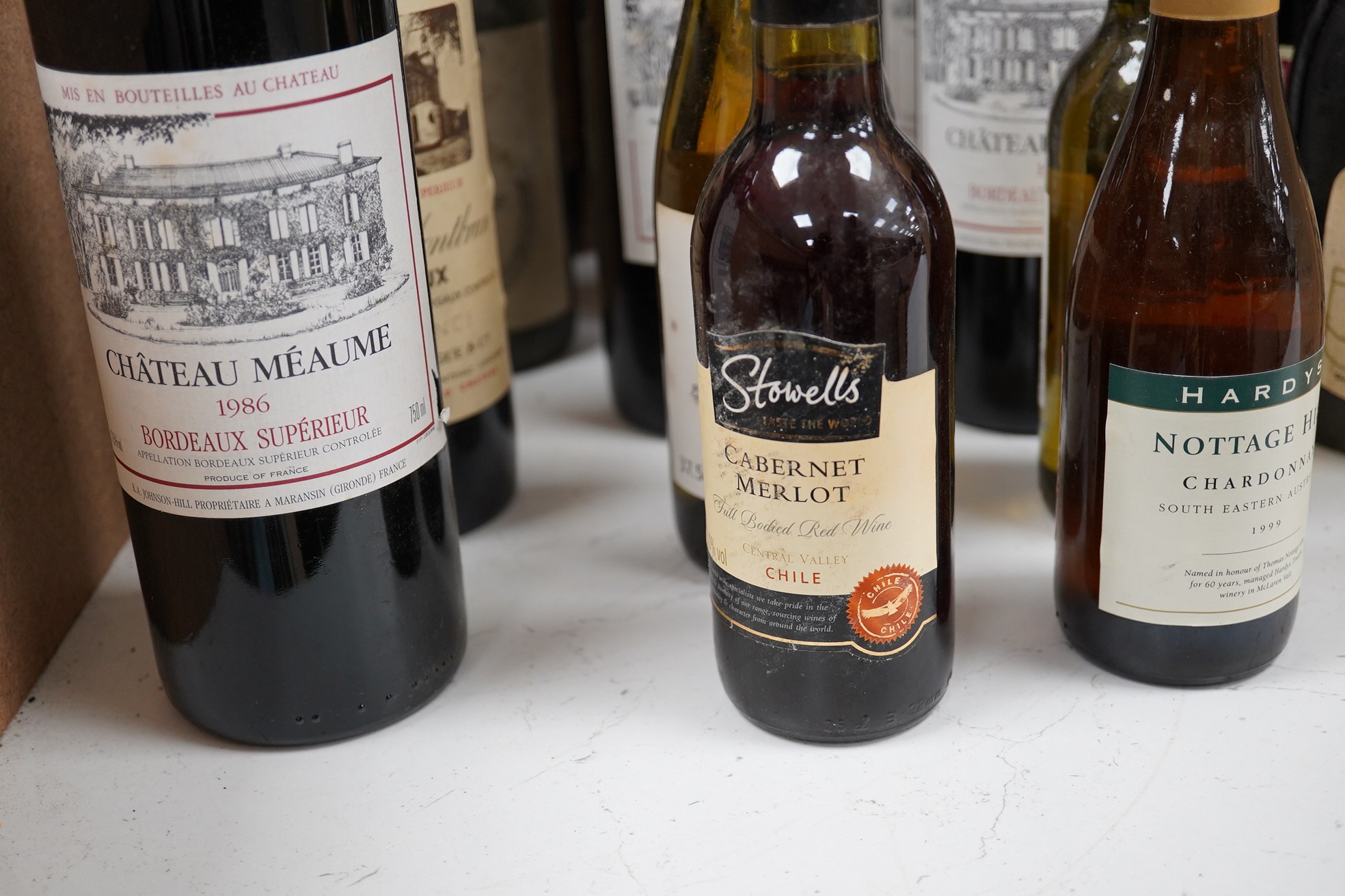 Twenty-five bottles and half bottles of wine, including; four bottles of Chateau Meaume 1986 Bordeaux Superior, a bottle of 1982 Chateau Montbrun Margaux, a Harveys Bourgogne Aligote 1970, etc. Condition - poor to fair